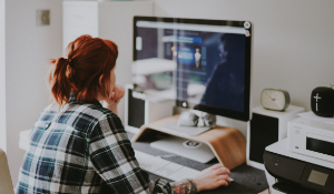 woman working on her computer desk